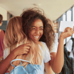 Image of students celebrating exam results. Photo from MonkeyBusiness sourced from Canva.