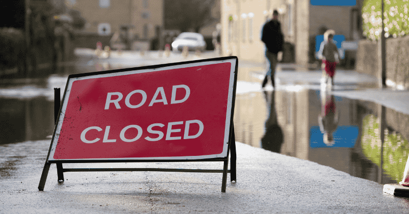 Photo of a road closed due to flooding. News post about resources available for Flood Action Week. Photo-Raylipscombe sourced from Canva.